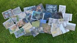 Postcards arranged on grass
